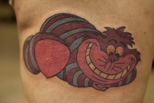 Чеширский кот символизирует. "Чеширский кот" - тату, заряженное позитивом